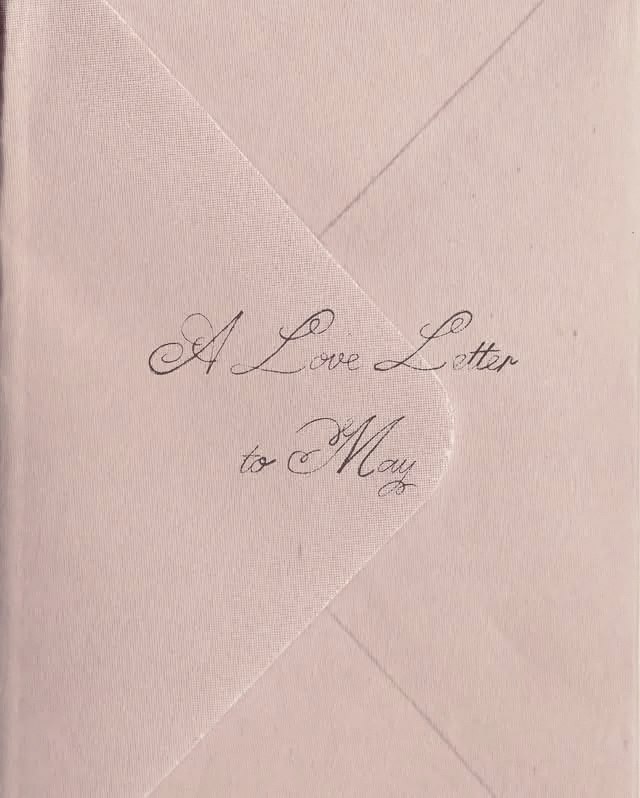 A dusty pink envelope with a sheer flap, marked A Love Letter to May in script